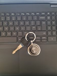 View larger photo: Bike's key with the keyring is on the laptop keyboard.
